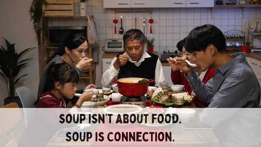 Asian family sharing soup together at dinner table