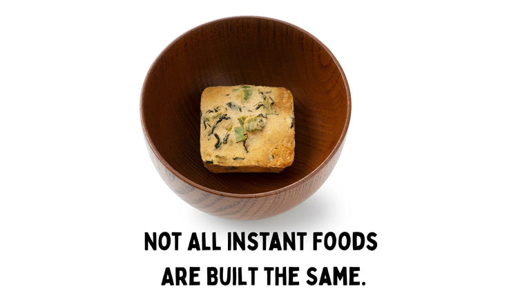 wooden bowl with a freeze dried miso soup cube in the middle 