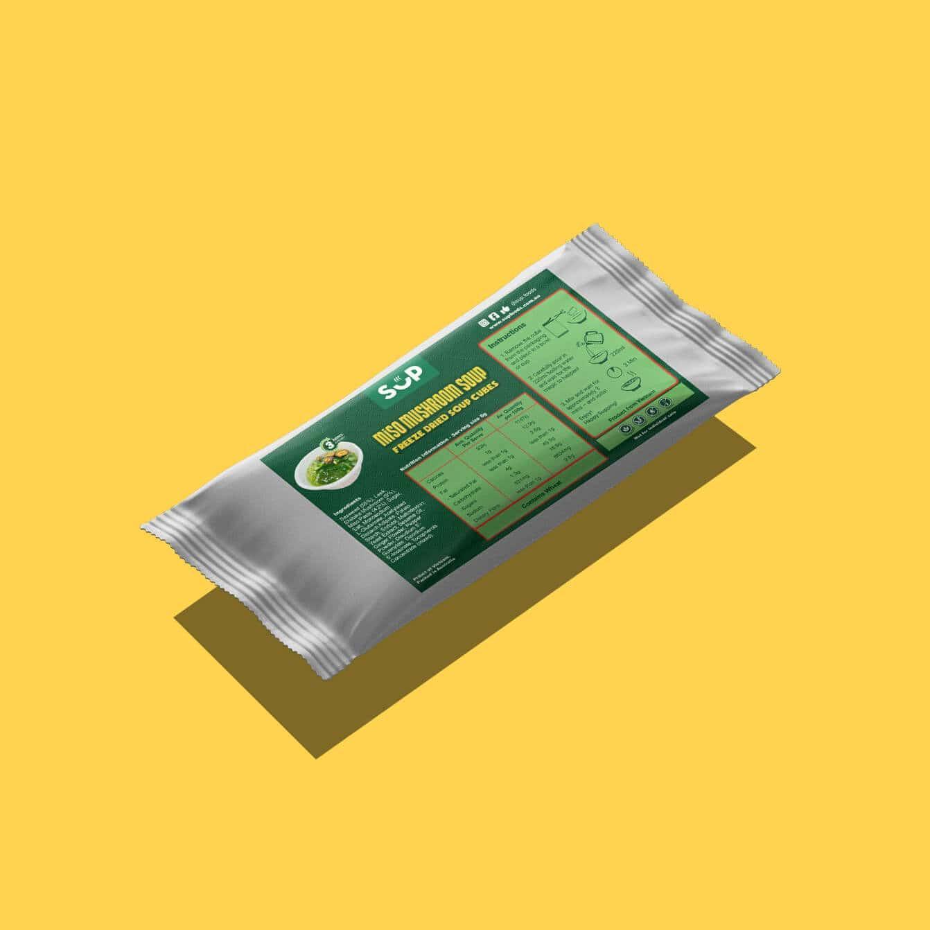 Miso Mushroom Soup freeze-dried soup cubes package with green label and preparation instructions on yellow background