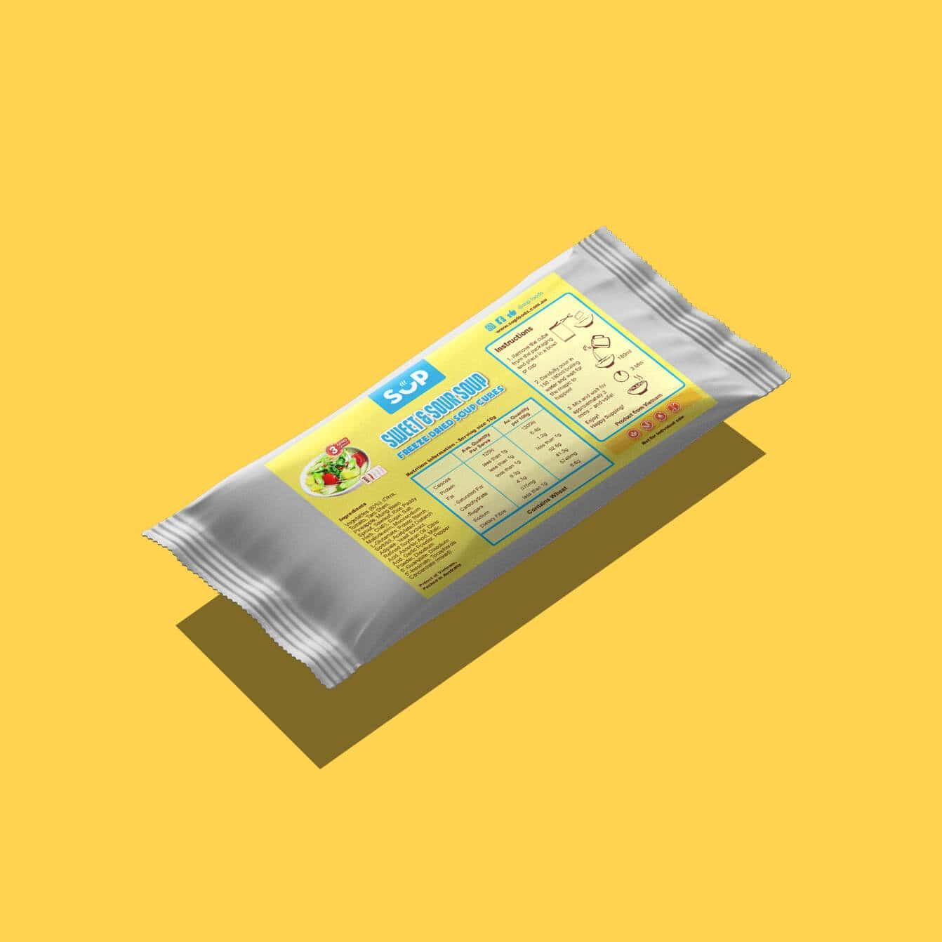 Package of vegan freeze-dried Sweet & Sour Soup cubes on yellow background with nutritional info